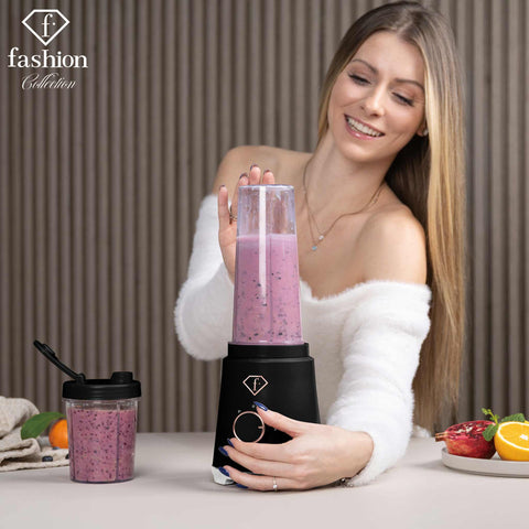 Product image of Smoothie maker. Part of the MATTE BLACK- ROSE GOLD . Features: • Material: stainless steel, plastic • Power: 320 W • 220-240 V 50/60 Hz • 2 pcs takeaway jar with lid: 300 ml and 600 ml • Length of power cord: 8.... (Studio view). Official Berlinger Haus product, boosted by Promintra sl.