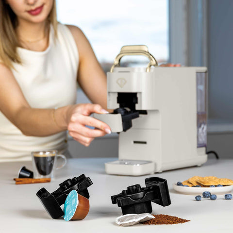 Product image of Capsule coffee maker 4in1. Part of the MATTE CREAM- GOLD . Features: • Voltage: 220-240V, 50/60Hz • Power: 1545W • 1,5L water tank • Detachable tray design • Accessories: • Nespresso small capsules holder • Dolce Gus.... (Studio view). Official Berlinger Haus product, boosted by Promintra sl.