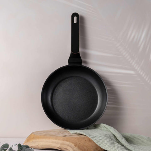 Product image of Frypan 24cm. Part of the Black Rose Collection . Features: • Material: forged aluminum with non-stick titanPro coating • Frypan Ø24*4,8 cm 1,7L • Color: matt black- rose gold REGISTERED DESIGN BY BERLINGER .... (Studio view). Official Berlinger Haus product, boosted by Promintra sl.
