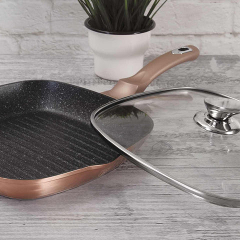 Product image of Grill pan with lid 28cm. Part of the Metallic Line Rose Gold Edition . Features: • Material: forged aluminum • Grill pan with lid Ø28*4,1 cm 2,1L • Color: metallic rose gold REGISTERED DESIGN BY BERLINGER HAUS!. (Studio view). Official Berlinger Haus product, boosted by Promintra sl.