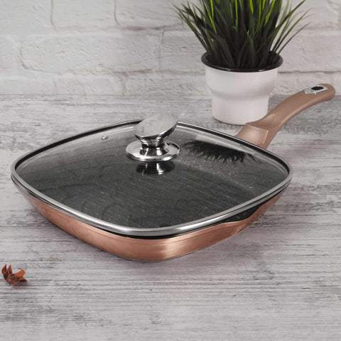 Product image of Grill pan with lid 28cm. Part of the Metallic Line Rose Gold Edition . Features: • Material: forged aluminum • Grill pan with lid Ø28*4,1 cm 2,1L • Color: metallic rose gold REGISTERED DESIGN BY BERLINGER HAUS!. (Studio view). Official Berlinger Haus product, boosted by Promintra sl.
