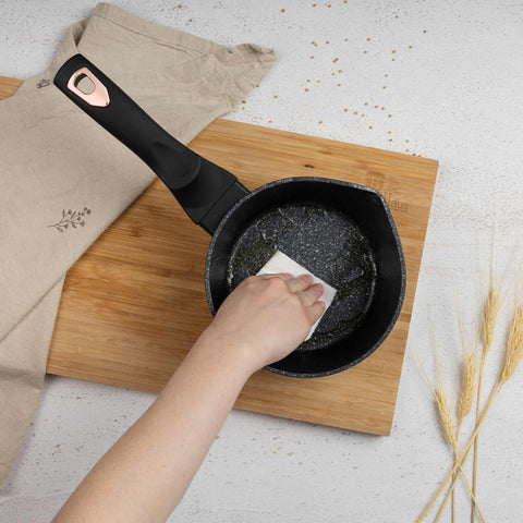 Product image of Sauce pan 16cm. Part of the Black Rose Collection . Features: • Material: forged aluminum • Sauce pan Ø16*7,5 cm 1,2L • Color: matt black- rose gold REGISTERED DESIGN BY BERLINGER HAUS!. (Studio view). Official Berlinger Haus product, boosted by Promintra sl.
