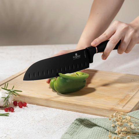 Product image of 4pcs knife set. Part of the Black Rose Collection . Features: • Material: stainless steel with black non-stick coating • Chef knife 20 cm • Santoku knife 17,5 cm • Utility knife 12,5 cm • Paring knife 9 cm • C.... (Studio view). Official Berlinger Haus product, boosted by Promintra sl.