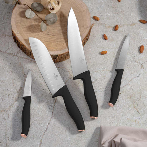Product image of 4pcs knife set. Part of the Black Rose Collection . Features: • Material: stainless steel • Chef knife 20 cm • Santoku knife 17,5 cm • Utility knife 12,5 cm • Paring knife 9 cm • Color: black- rose gold REGIST.... (Studio view). Official Berlinger Haus product, boosted by Promintra sl.
