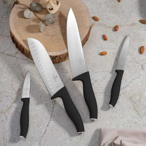 Product image of 4pcs knife set. Part of the Black Vantage Collection/Matte Black Collection/Black Silver Collection . Features: • Material: stainless steel • Chef knife 20 cm • Santoku knife 17,5 cm • Utility knife 12,5 cm • Paring knife 9 cm • Color: black- silver REGISTERE.... (Studio view). Official Berlinger Haus product, boosted by Promintra sl.