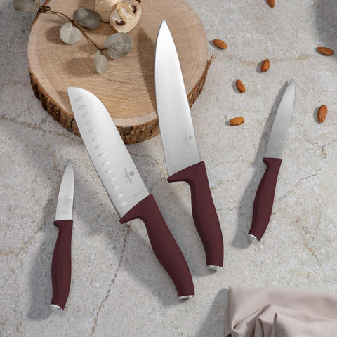 Product image of 4pcs knife set. Part of the Leonardo Collection . Features: • Material: stainless steel • Chef knife 20 cm • Santoku knife 17,5 cm • Utility knife 12,5 cm • Paring knife 9 cm • Color: matt bordeaux REGISTERE.... (Studio view). Official Berlinger Haus product, boosted by Promintra sl.