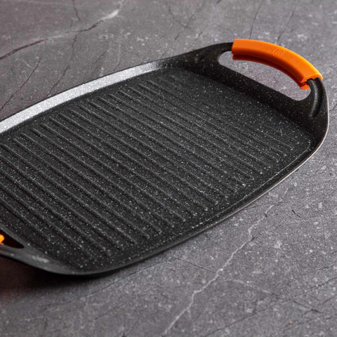 Product image of Grill plate 47cm. Part of the Granit Diamond Line . Features: • Material: aluminum • Size: 47*29 cm • Color: black/ orange • FREE 2 PCS HEAT RESISTANT SILICONE HANDLE. (Studio view). Official Berlinger Haus product, boosted by Promintra sl.