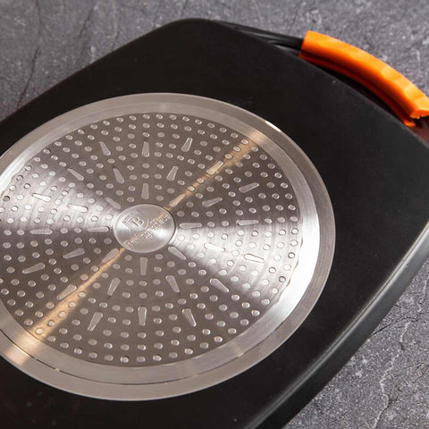 Product image of Grill plate 47cm. Part of the Granit Diamond Line . Features: • Material: aluminum • Size: 47*29 cm • Color: black/ orange • FREE 2 PCS HEAT RESISTANT SILICONE HANDLE. (Studio view). Official Berlinger Haus product, boosted by Promintra sl.