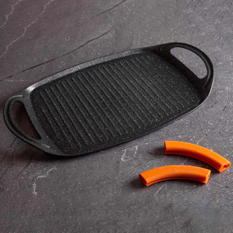 Product image of Grill plate 47cm. Part of the Granit Diamond Line . Features: • Material: aluminum • Size: 47*29 cm • Color: black/ orange • FREE 2 PCS HEAT RESISTANT SILICONE HANDLE. (Studio view). Official Berlinger Haus product, boosted by Promintra sl.
