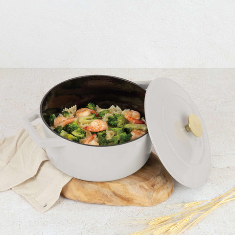 Product image of Casserole 24cm cast iron. Part of the Sahara Collection . Features: • Material: cast iron with 3 layers shiny ENAMEL coating • Size: Ø24*11 cm 4,35 L • Color: cream. (Studio view). Official Berlinger Haus product, boosted by Promintra sl.