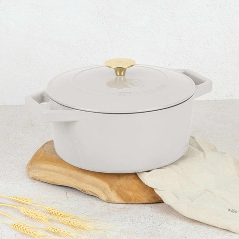 Product image of Casserole 24cm cast iron. Part of the Sahara Collection . Features: • Material: cast iron with 3 layers shiny ENAMEL coating • Size: Ø24*11 cm 4,35 L • Color: cream. (Studio view). Official Berlinger Haus product, boosted by Promintra sl.