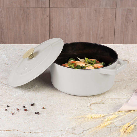 Product image of Casserole 24cm cast iron. Part of the Sahara Collection . Features: • Material: cast iron with 3 layers shiny ENAMEL coating • Size: Ø24*11 cm 4,35 L • Color: cream. (Studio view). Official Berlinger Haus product, boosted by Promintra sl.