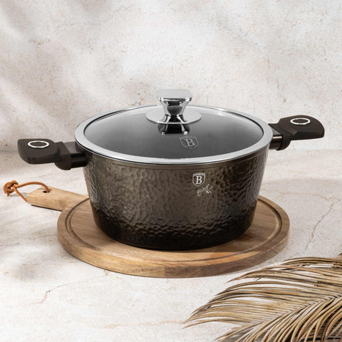 Product image of Casserole with lid 24cm. Part of the Primal Gloss Collection . Features: • Material: forged aluminum • Casserole with lid Ø24*11,8 cm 4,1L • Color: dark grey with black shadow and shining hammer effect REGISTERED DESIGN .... (Studio view). Official Berlinger Haus product, boosted by Promintra sl.