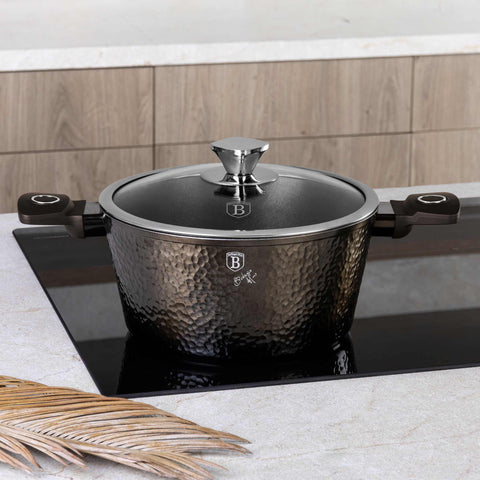 Product image of Casserole with lid 24cm. Part of the Primal Gloss Collection . Features: • Material: forged aluminum • Casserole with lid Ø24*11,8 cm 4,1L • Color: dark grey with black shadow and shining hammer effect REGISTERED DESIGN .... (Studio view). Official Berlinger Haus product, boosted by Promintra sl.