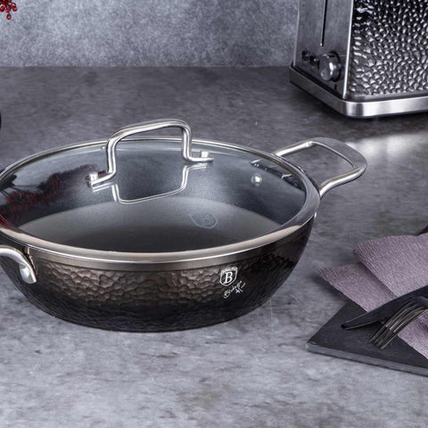 Product image of Shallow pot with lid 28cm. Part of the Shine Basalt Collection . Features: • Material: forged aluminum • Shallow pot with lid Ø28*7,5 cm 3,8L • Color: black with shining hammer effect REGISTERED DESIGN BY BERLINGER HAUS!. (Studio view). Official Berlinger Haus product, boosted by Promintra sl.