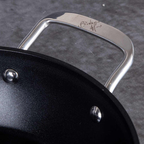 Product image of Shallow pot with lid 28cm. Part of the Shine Basalt Collection . Features: • Material: forged aluminum • Shallow pot with lid Ø28*7,5 cm 3,8L • Color: black with shining hammer effect REGISTERED DESIGN BY BERLINGER HAUS!. (Studio view). Official Berlinger Haus product, boosted by Promintra sl.