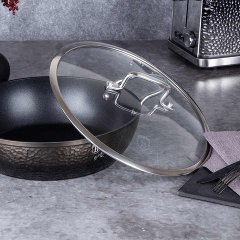 Product image of Shallow pot with lid 28cm. Part of the Shine Basalt Collection . Features: • Material: forged aluminum • Shallow pot with lid Ø28*7,5 cm 3,8L • Color: black with shining hammer effect REGISTERED DESIGN BY BERLINGER HAUS!. (Studio view). Official Berlinger Haus product, boosted by Promintra sl.