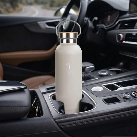 Product image of Flask with bamboo lid 0,6L. Part of the Sahara Collection . Features: • Material: 18/10 stainless steel with matt powder coating • Bamboo lid • Capacity: 0,6 L • Color: matt cream • Packing: giftbox. (Studio view). Official Berlinger Haus product, boosted by Promintra sl.
