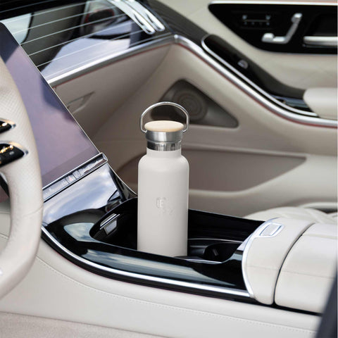 Product image of Flask with bamboo lid 0,6L. Part of the Sahara Collection . Features: • Material: 18/10 stainless steel with matt powder coating • Bamboo lid • Capacity: 0,6 L • Color: matt cream • Packing: giftbox. (Studio view). Official Berlinger Haus product, boosted by Promintra sl.