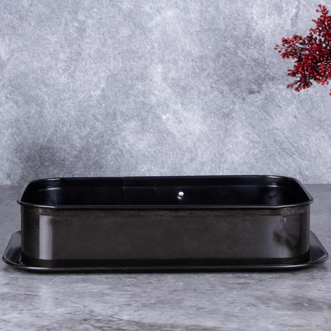 Product image of Rectangle springform 39x27cm. Part of the Metallic Line Shiny Black Edition . Features: • Material: carbon steel with titan non-stick coating • Size: 35*23*6,5 cm • Base size: 39*27 cm • Color: metallic black. (Studio view). Official Berlinger Haus product, boosted by Promintra sl.