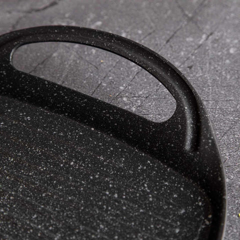 Product image of Grill plate 47cm. Part of the Metallic Line Carbon Pro Edition . Features: • Material: forged aluminum • Size: 47*29 cm • Color: dark grey • FREE 2 PCS HEAT RESISTANT SILICONE HANDLE. (Studio view). Official Berlinger Haus product, boosted by Promintra sl.