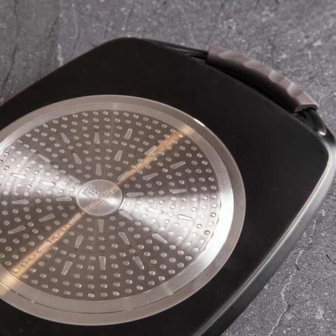 Product image of Grill plate 47cm. Part of the Metallic Line Carbon Pro Edition . Features: • Material: forged aluminum • Size: 47*29 cm • Color: dark grey • FREE 2 PCS HEAT RESISTANT SILICONE HANDLE. (Studio view). Official Berlinger Haus product, boosted by Promintra sl.