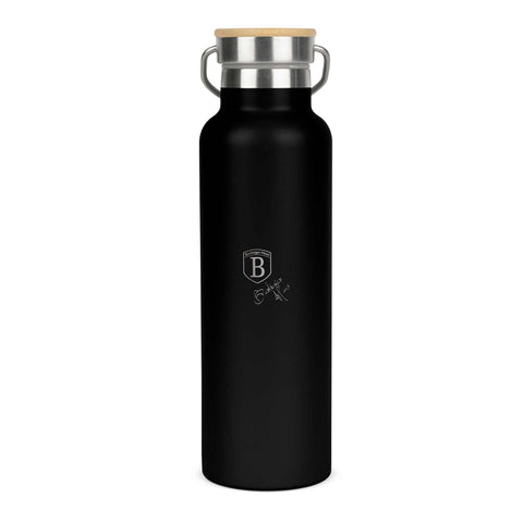 Product image of Flask with bamboo lid 0,6L. Part of the Matte Black Collection . Features: • Material: 18/10 stainless steel with matt powder coating • Bamboo lid • Capacity: 0,6 L • Color: black- silver • Packing: giftbox. (Studio view). Official Berlinger Haus product, boosted by Promintra sl.