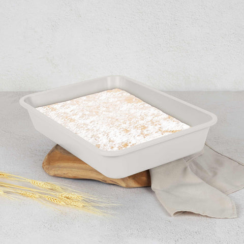 Product image of Oblong roaster 40x28cm. Part of the Sahara Collection . Features: • Material: carbon steel with non-stick titanPro coating • Size: 40*28*7 cm • Color: matt cream. (Studio view). Official Berlinger Haus product, boosted by Promintra sl.