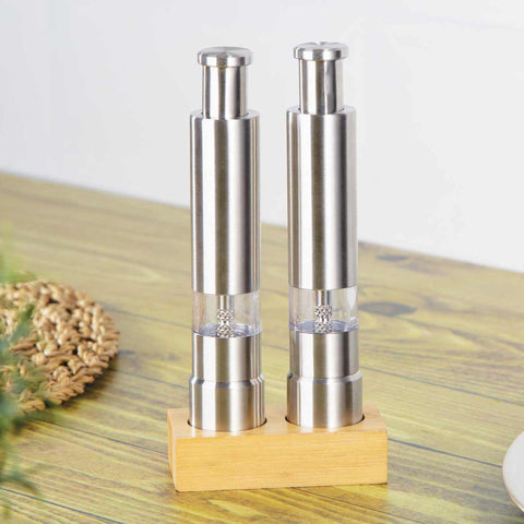 Product image of 2pcs salt and pepper mill set with bamboo stand. Part of the Black Vantage Collection/Matte Black Collection/Black Silver Collection/Eternal Collection . Features: • Material: 18/10 stainless steel with bamboo stand • Color: stainless steel. (Conceptual view). Official Berlinger Haus product, boosted by Promintra sl.