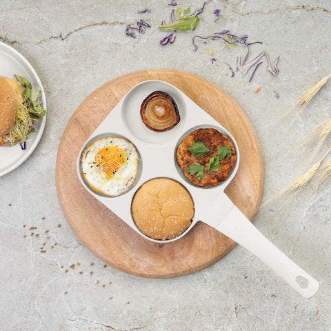 Product image of 4holes blank hamburger pan 20cm. Part of the Sahara Collection . Features: • Material: cast aluminium • Pancake pan Ø20*2,2 cm • Color: matt cream. (Studio view). Official Berlinger Haus product, boosted by Promintra sl.