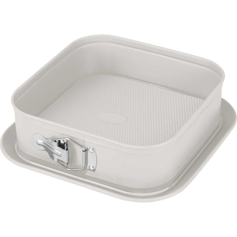 Product image of Square springform 28x28cm. Part of the Sahara Collection . Features: • Material: carbon steel with non-stick titanPro coating • Size: 23,8*23,8*8 cm • Base size: 28*28 cm • Color: matt cream. (Studio view). Official Berlinger Haus product, boosted by Promintra sl.