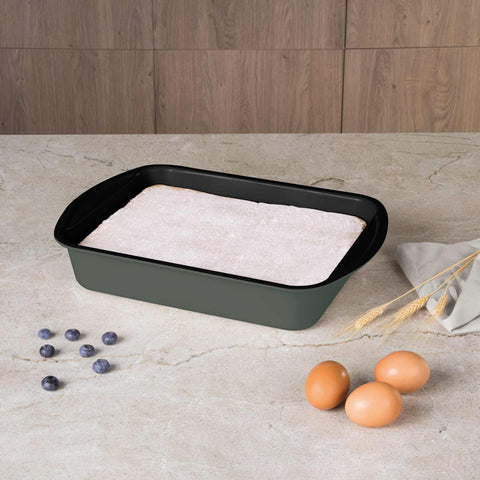 Product image of Oblong roaster 35x27cm. Part of the Matte Green Collection . Features: • Material: carbon steel with titanPro non-stick coating • Size: 35*27*6,5 cm • Color: matt green. (Studio view). Official Berlinger Haus product, boosted by Promintra sl.