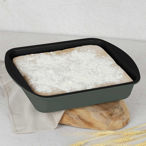 Product image of Oblong roaster 35x27cm. Part of the Matte Green Collection . Features: • Material: carbon steel with titanPro non-stick coating • Size: 35*27*6,5 cm • Color: matt green. (Studio view). Official Berlinger Haus product, boosted by Promintra sl.