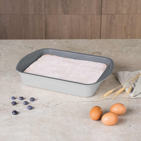 Product image of Oblong roaster 35x27cm. Part of the Aspen Collection . Features: • Material: carbon steel with titanPro non-stick coating • Size: 35*27*6,5 cm • Color: matt grey. (Lifestyle view). Official Berlinger Haus product, boosted by Promintra sl.