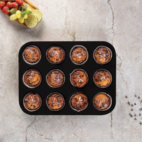 Product image of 12cups muffin pan. Part of the Matte Green Collection . Features: • Material: carbon steel with titanPro non-stick coating • Size: 35*26,5*3 cm • Color: matt green. (Studio view). Official Berlinger Haus product, boosted by Promintra sl.