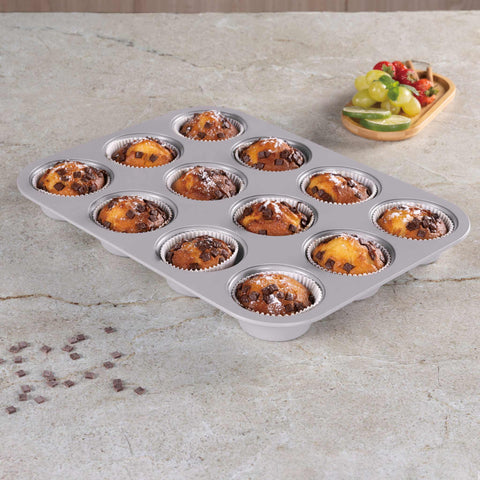 Product image of 12cups muffin pan. Part of the Taupe Collection . Features: • Material: carbon steel with titanPro non-stick coating • Size: 35*26,5*3 cm • Color: matt taupe. (Studio view). Official Berlinger Haus product, boosted by Promintra sl.