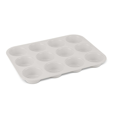Product image of 12cups muffin pan. Part of the Sahara Collection . Features: • Material: carbon steel with titanPro non-stick coating • Size: 35*26,5*3 cm • Color: matt cream. (Studio view). Official Berlinger Haus product, boosted by Promintra sl.