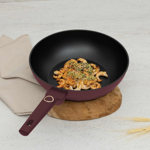 Product image of Wok 28cm. Part of the Leonardo Collection . Features: • Material: forged aluminum with non-stick titanPro coating • Wok Ø28*7,4 cm 3,2L • Color: matt bordeaux REGISTERED DESIGN BY BERLINGER HAUS!. (Studio view). Official Berlinger Haus product, boosted by Promintra sl.