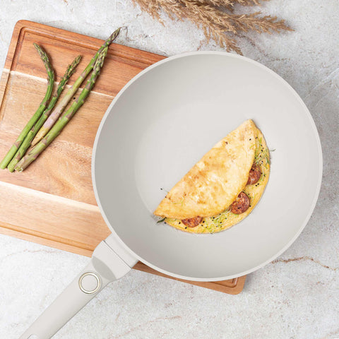 Product image of Wok 28cm. Part of the Sahara Collection . Features: • Material: forged aluminum with non-stick titanPro coating • Wok Ø28*7,4 cm 3,2L • Color: matt cream REGISTERED DESIGN BY BERLINGER HAUS!. (Studio view). Official Berlinger Haus product, boosted by Promintra sl.