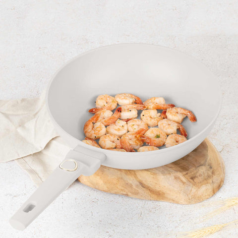 Product image of Wok 28cm. Part of the Sahara Collection . Features: • Material: forged aluminum with non-stick titanPro coating • Wok Ø28*7,4 cm 3,2L • Color: matt cream REGISTERED DESIGN BY BERLINGER HAUS!. (Studio view). Official Berlinger Haus product, boosted by Promintra sl.