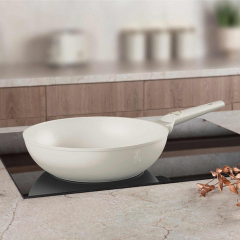 Product image of Wok 28cm. Part of the Sahara Collection . Features: • Material: forged aluminum with non-stick titanPro coating • Wok Ø28*7,4 cm 3,2L • Color: matt cream REGISTERED DESIGN BY BERLINGER HAUS!. (Studio view). Official Berlinger Haus product, boosted by Promintra sl.