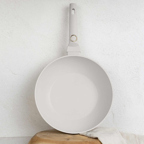 Product image of Wok 28cm. Part of the Sahara Collection . Features: • Material: forged aluminum with non-stick titanPro coating • Wok Ø28*7,4 cm 3,2L • Color: matt cream REGISTERED DESIGN BY BERLINGER HAUS!. (Studio view). Official Berlinger Haus product, boosted by Promintra sl.