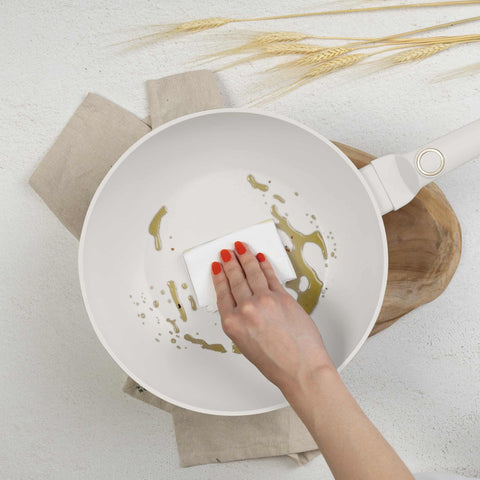 Product image of Wok 28cm. Part of the Sahara Collection . Features: • Material: forged aluminum with non-stick titanPro coating • Wok Ø28*7,4 cm 3,2L • Color: matt cream REGISTERED DESIGN BY BERLINGER HAUS!. (Studio view). Official Berlinger Haus product, boosted by Promintra sl.