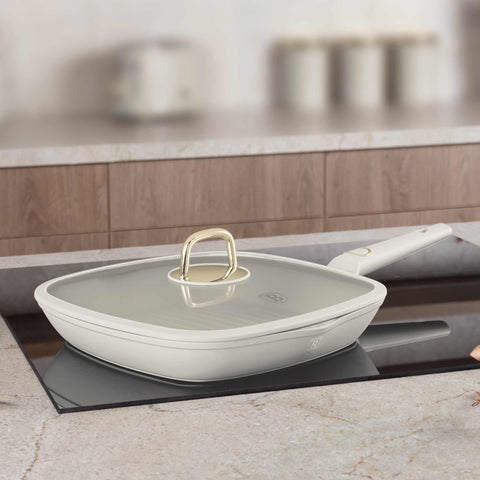 Product image of Grill pan with lid 28cm. Part of the Sahara Collection . Features: • Material: forged aluminum with non-stick titanPro coating • Grill pan with lid Ø28*4,1 cm 2,1L • Color: matt cream REGISTERED DESIGN BY BERLINGER.... (Studio view). Official Berlinger Haus product, boosted by Promintra sl.