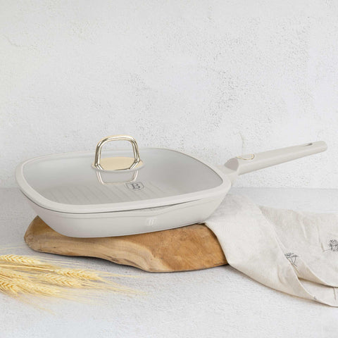 Product image of Grill pan with lid 28cm. Part of the Sahara Collection . Features: • Material: forged aluminum with non-stick titanPro coating • Grill pan with lid Ø28*4,1 cm 2,1L • Color: matt cream REGISTERED DESIGN BY BERLINGER.... (Studio view). Official Berlinger Haus product, boosted by Promintra sl.