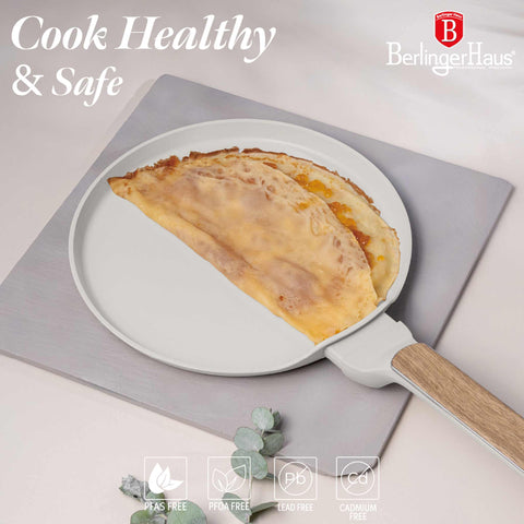 Product image of Pancake pan 25cm. Part of the Sahara Nordic Collection . Features: • Material: forged aluminum with non-stick titanPro coating • Pancake pan Ø25*2,2 cm • Color: matt cream, wooden REGISTERED DESIGN BY BERLINGER HAUS!. (Studio view). Official Berlinger Haus product, boosted by Promintra sl.