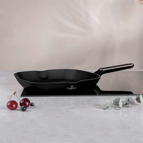Product image of Grill pan 28cm. Part of the Black Rose Collection . Features: • Material: forged aluminum with non-stick titanPro coating • Grill pan Ø28*4,1 cm 2,1L • Color: matt black- rose gold REGISTERED DESIGN BY BERLING.... (Studio view). Official Berlinger Haus product, boosted by Promintra sl.