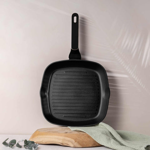 Product image of Grill pan 28cm. Part of the Black Rose Collection . Features: • Material: forged aluminum with non-stick titanPro coating • Grill pan Ø28*4,1 cm 2,1L • Color: matt black- rose gold REGISTERED DESIGN BY BERLING.... (Studio view). Official Berlinger Haus product, boosted by Promintra sl.