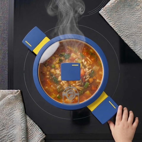 Product image of Mini casserole with lid 14cm. Part of the Minions Collection . Features: • Material: forged aluminum with non-stick titanPro coating • Casserole with lid Ø14 cm • Color: yellow- blue. (Studio view). Official Berlinger Haus product, boosted by Promintra sl.
