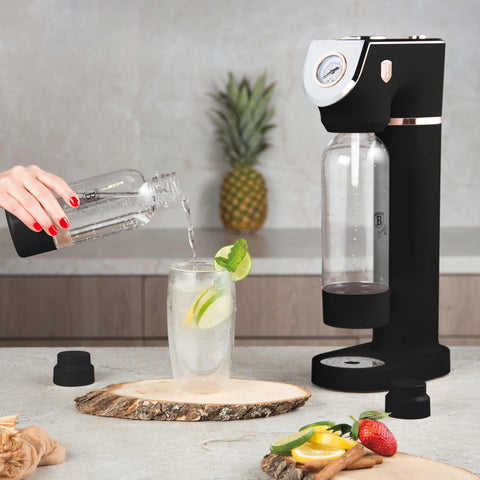 Product image of Soda maker with 2bottles and barometer universal CO2cylinders size. Part of the Black Rose Collection . Features: • Material: stainless steel, pp • Size: 43,5*22*12 cm • 2 pcs pp bottle with cup: 1,0L and 0,5L • Universal, standard CO2 cylinders size (not inclu.... (Studio view). Official Berlinger Haus product, boosted by Promintra sl.